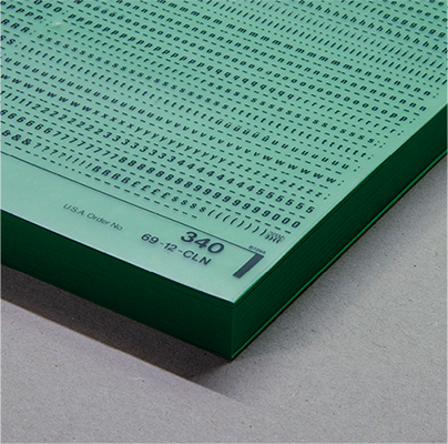 a chroma key green empty book, with letraset transfer
                lettering sheet between its pages